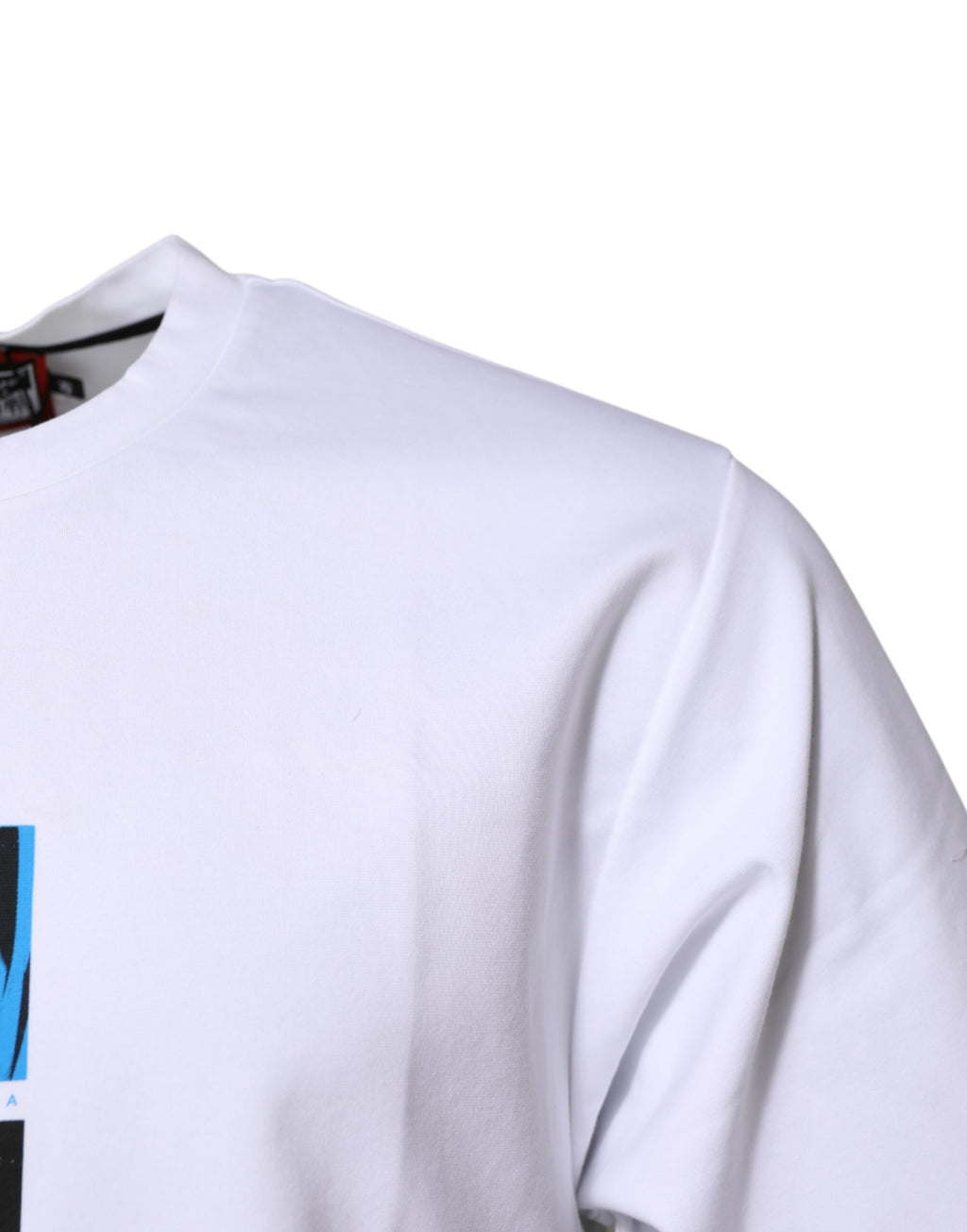 T-shirt blanc en coton Dolce & Gabbana avec col rond et motif graphique visible sur le devant.