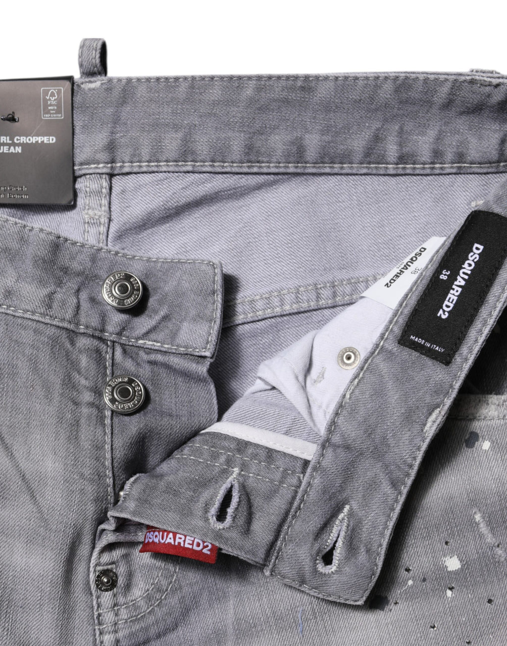 Jeans gris délavé taille moyenne ajustée de Dsquared², coupe tapered, en denim avec détails usés visibles.