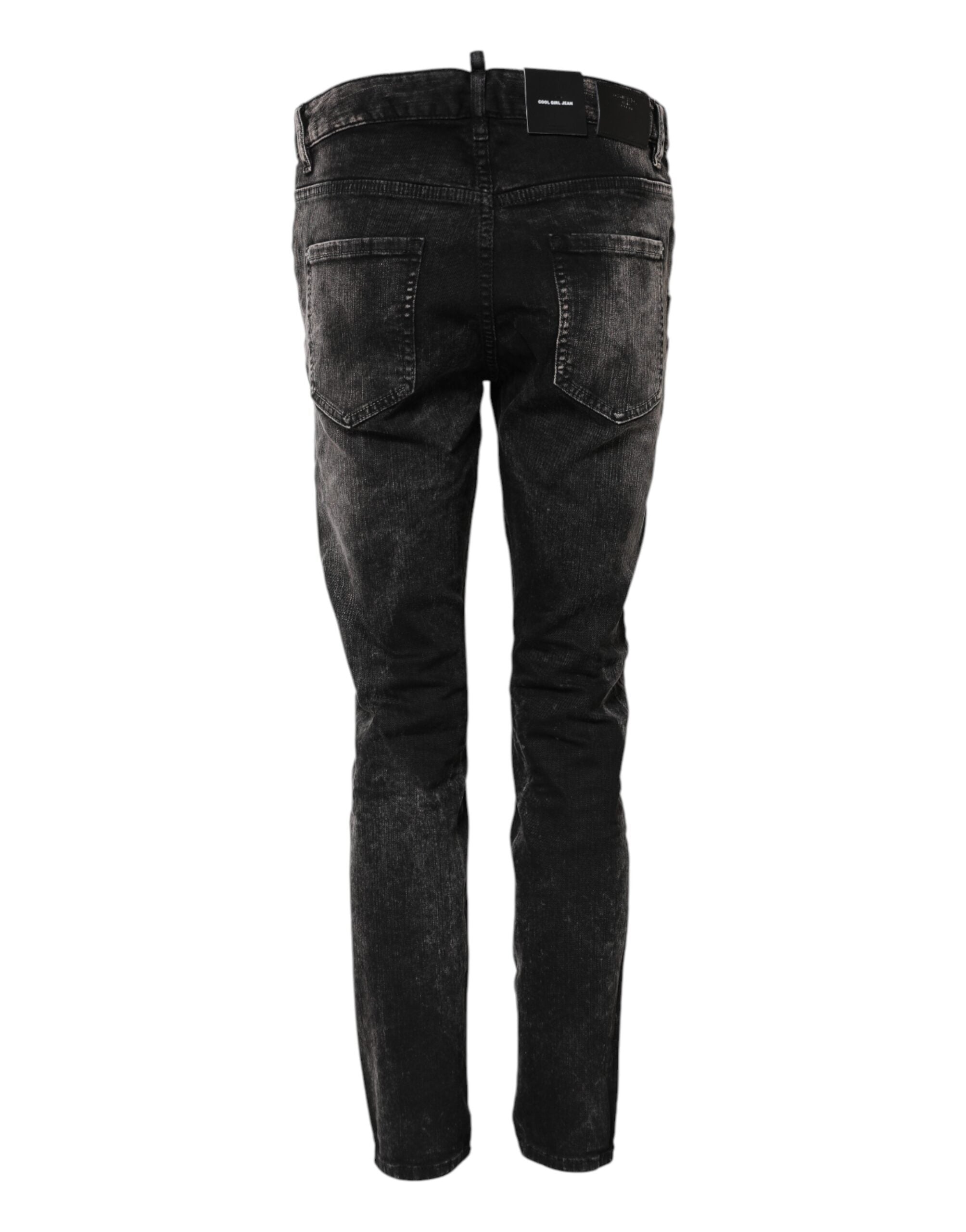 Jeans en denim délavé noir de coupe tapered à taille mi-hauteur de la marque Dsquared², visibles avec détails de couture.