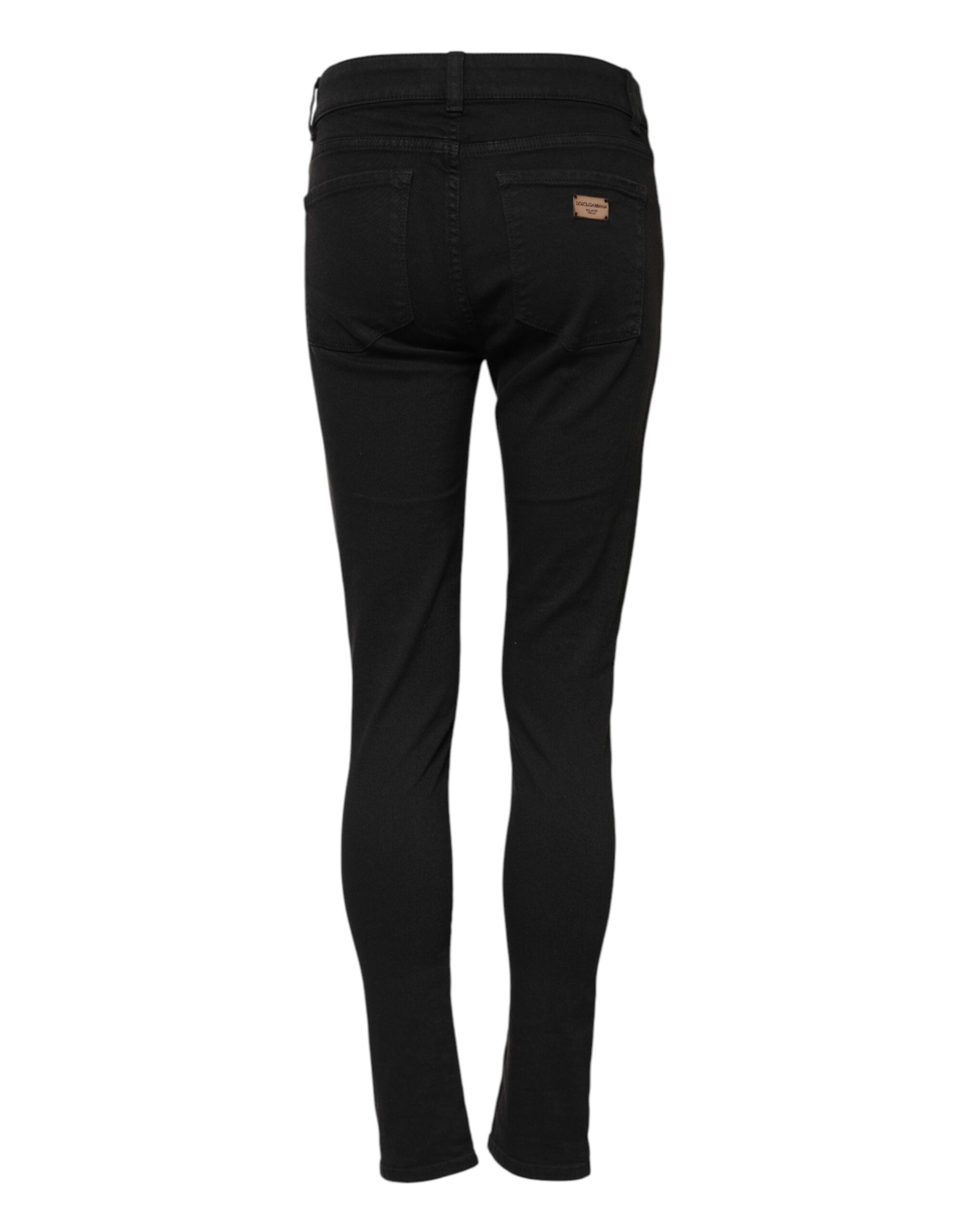 Jean slim en coton stretch noir de Dolce & Gabbana, coupe ajustée et moderne, visible en détail dans l'image.