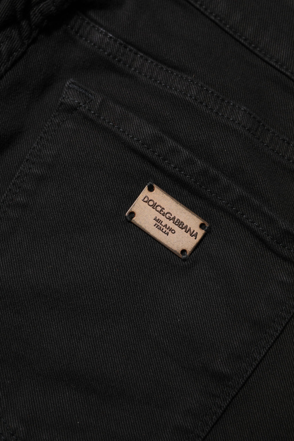 Jeans slim en coton stretch noir de Dolce & Gabbana, coupe ajustée, avec détails en denim authentique.