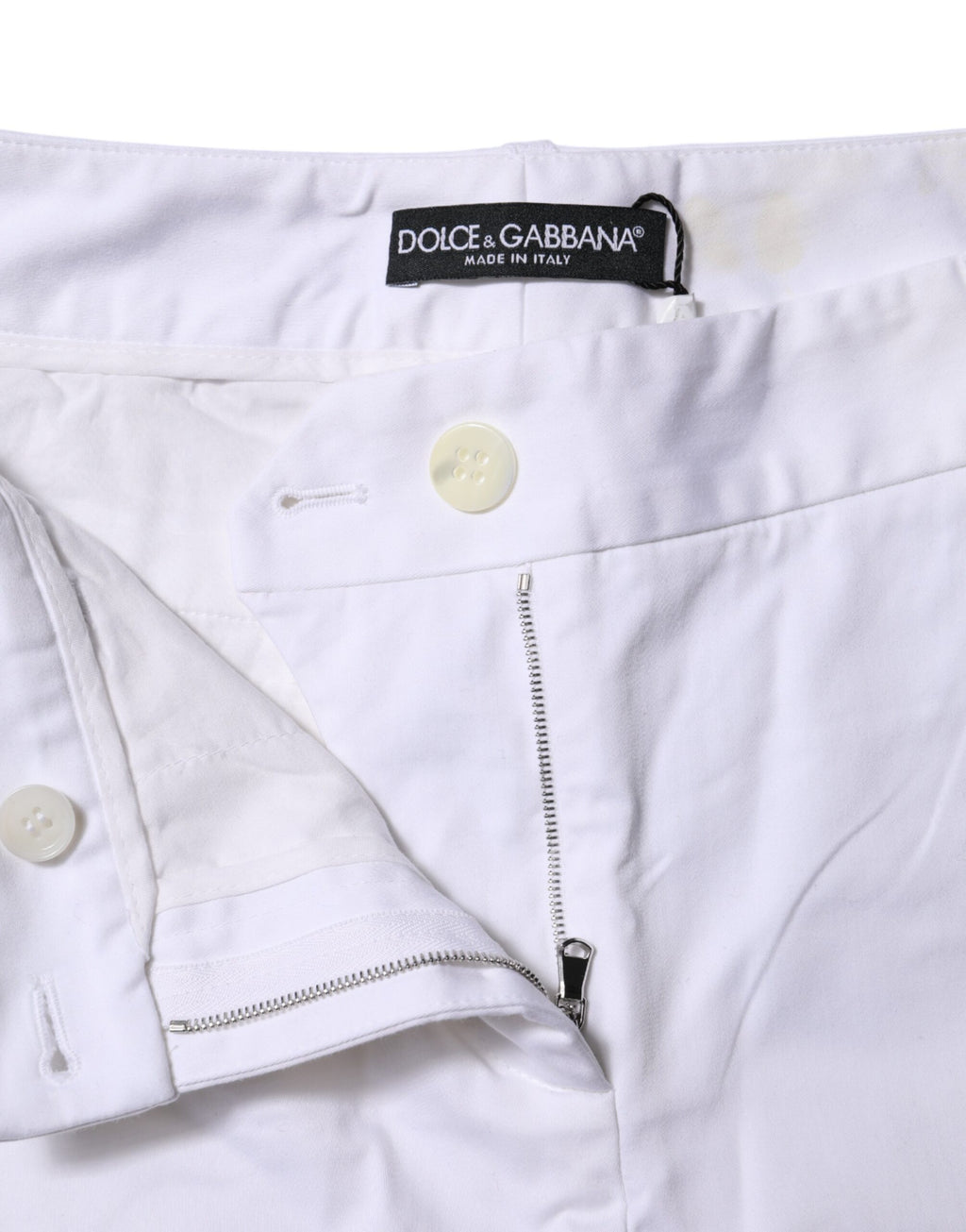 Jeans blancs en coton stretch Dolce & Gabbana, taille mi-haute, mode décontractée, visible en gros plan sur le produit.