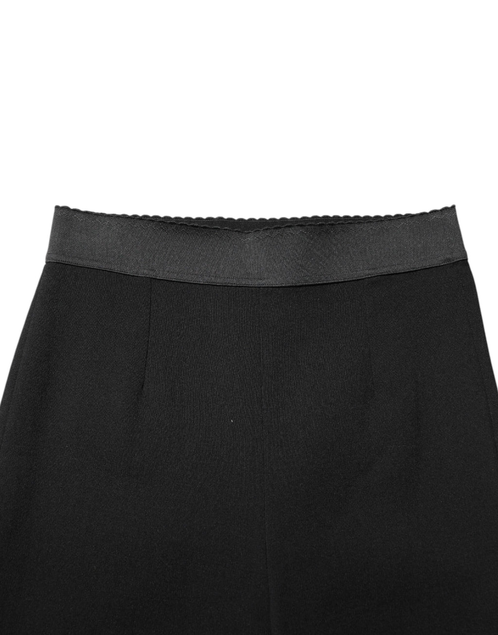Leggings en laine noire Dolce & Gabbana, pantalon stretch ajusté avec finition élégante, porté comme vêtement de mode sophistiqué.