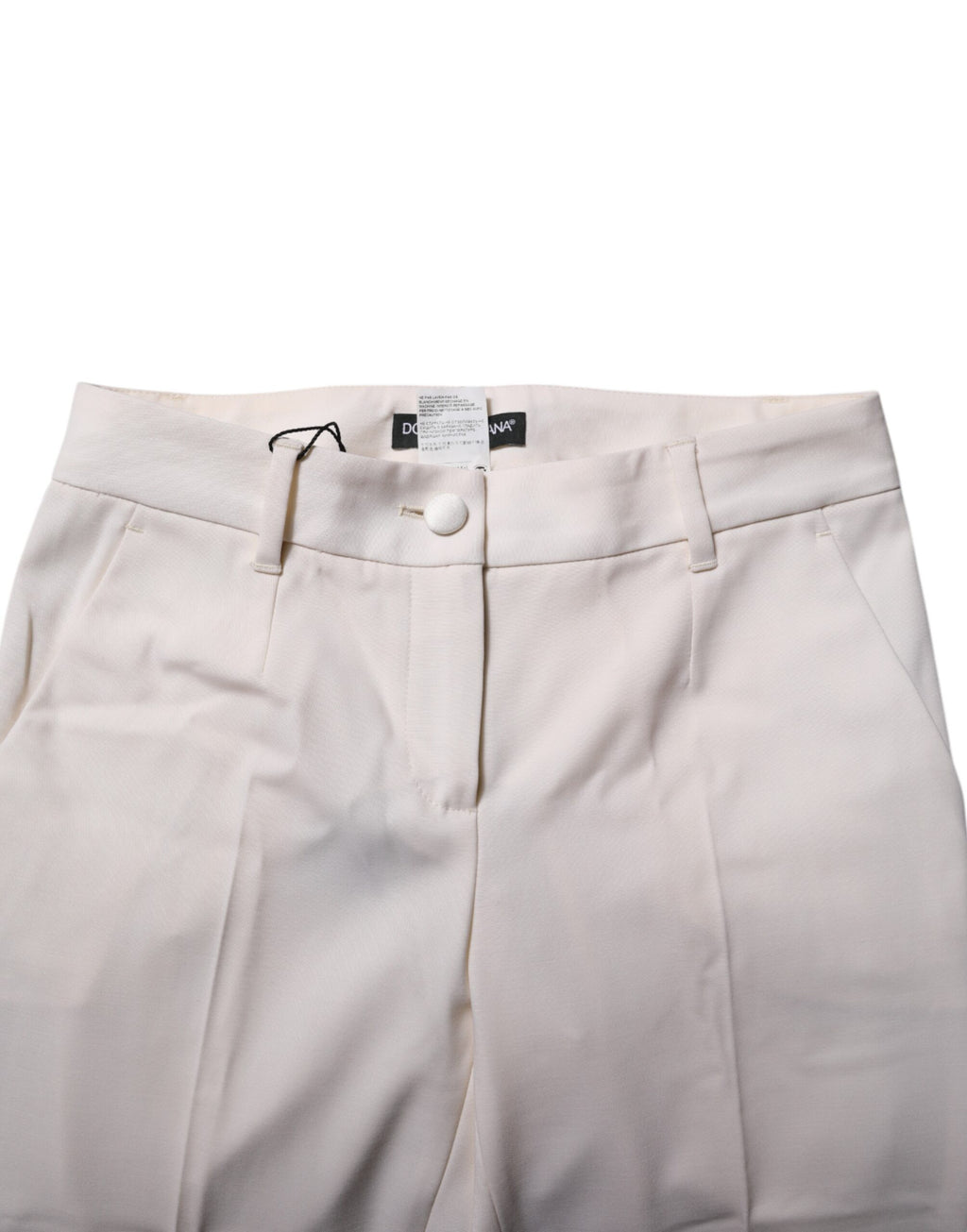 Pantalons blancs en laine Dolce & Gabbana, coupe tapered à taille haute, visibles sur une mannequin.