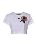 T-shirt courte blanche Dolce & Gabbana en dentelle florale avec détails en DG, vue de face.