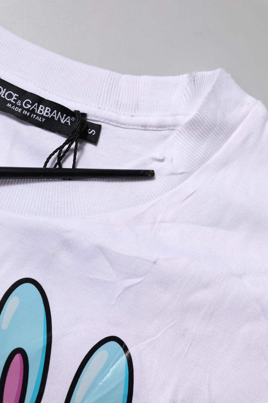 T-shirt blanc en coton Dolce & Gabbana avec impression graphique à col rond, vue de face.