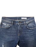 Jeans skinny en denim tacheté bleu Dolce & Gabbana, en coton délavé avec des détails effilochés.