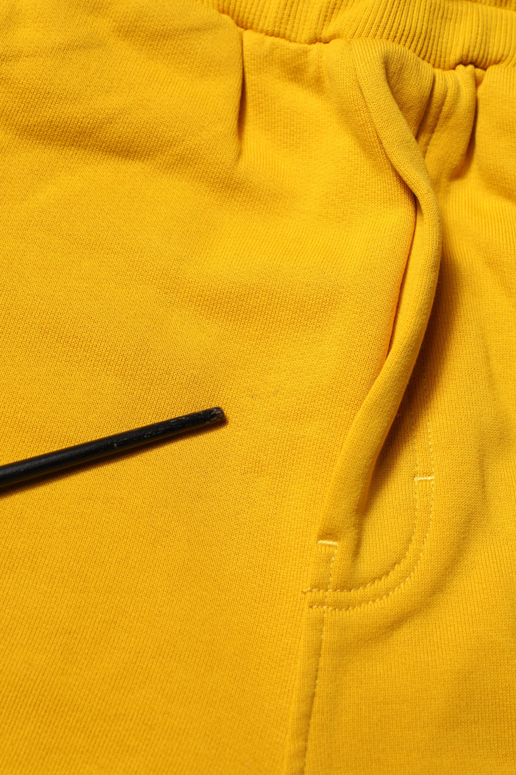 Pantalon jogger en coton jaune de Dolce & Gabbana, pantalon décontracté avec ourlet côtelé et ceinture élastique.