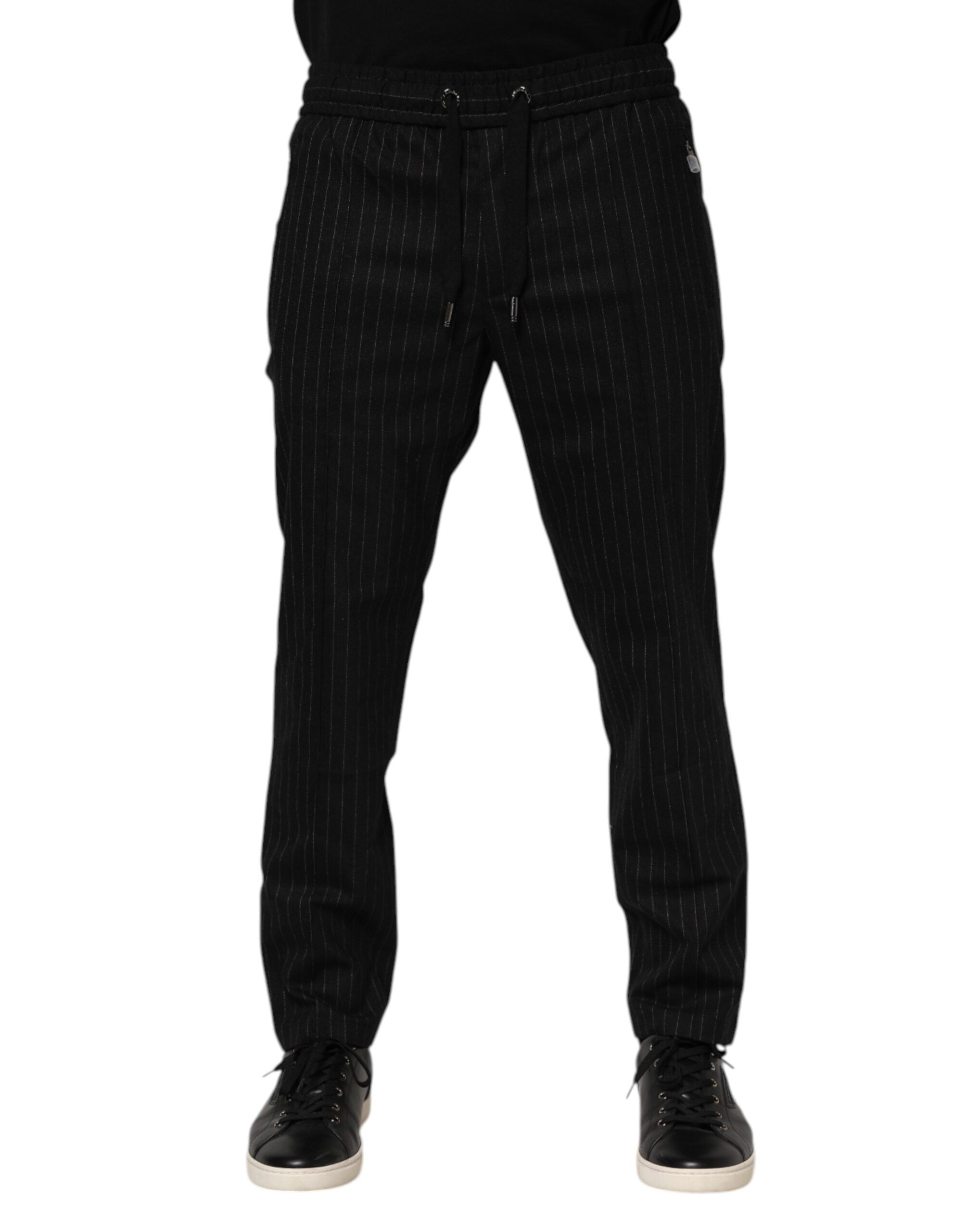 Pantalon jogger homme en laine noire à rayures Dolce & Gabbana, coupe décontractée et détails élégants.