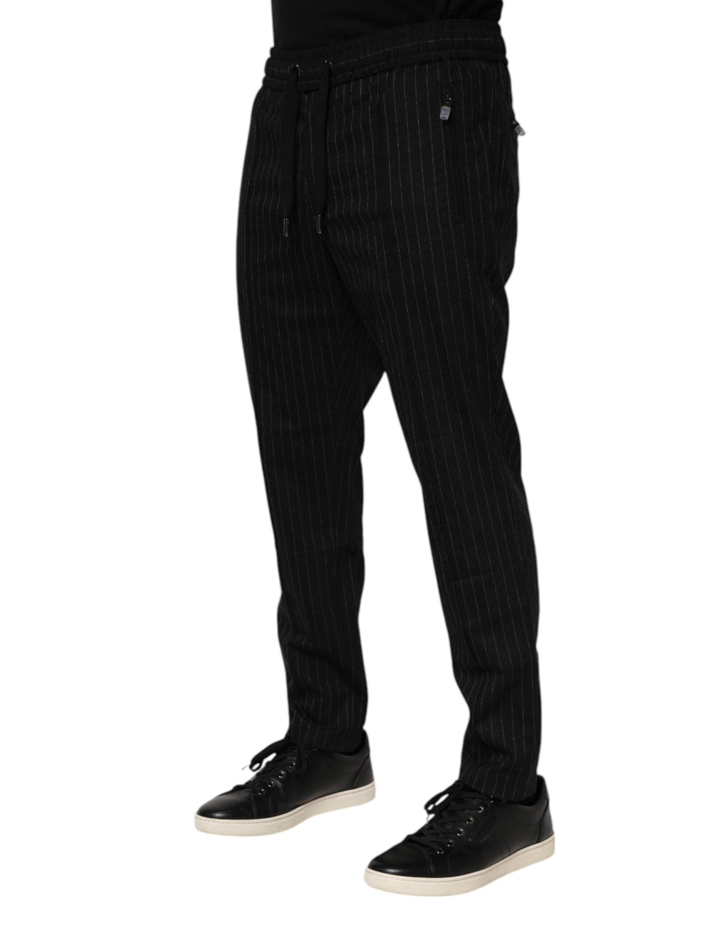 Pantalon jogger en laine noire à rayures Dolce & Gabbana pour homme, coupe décontractée et style élégant.