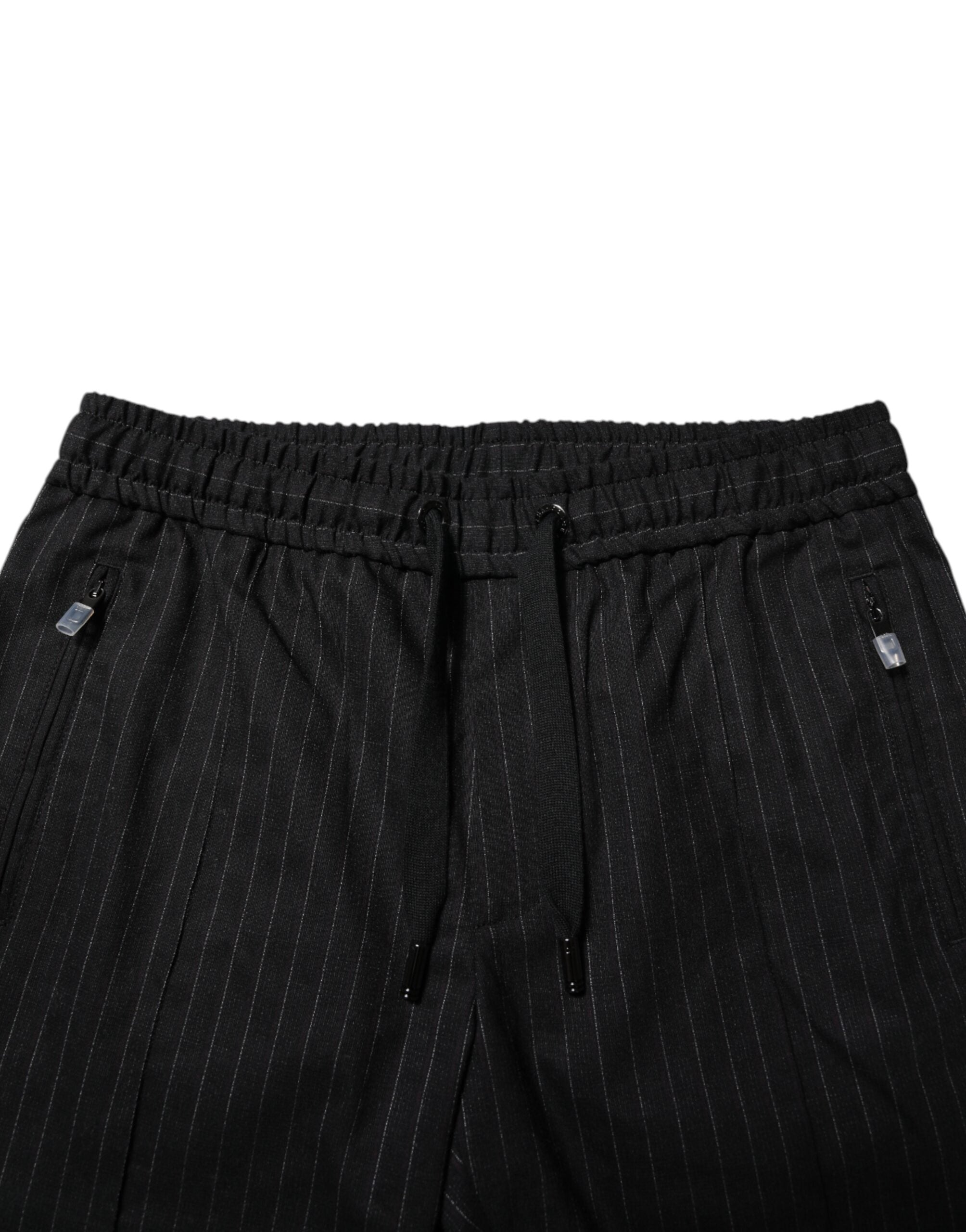 Pantalons jogger pour homme en laine noire à rayures, de la marque Dolce & Gabbana, affichant un style décontracté et élégant.