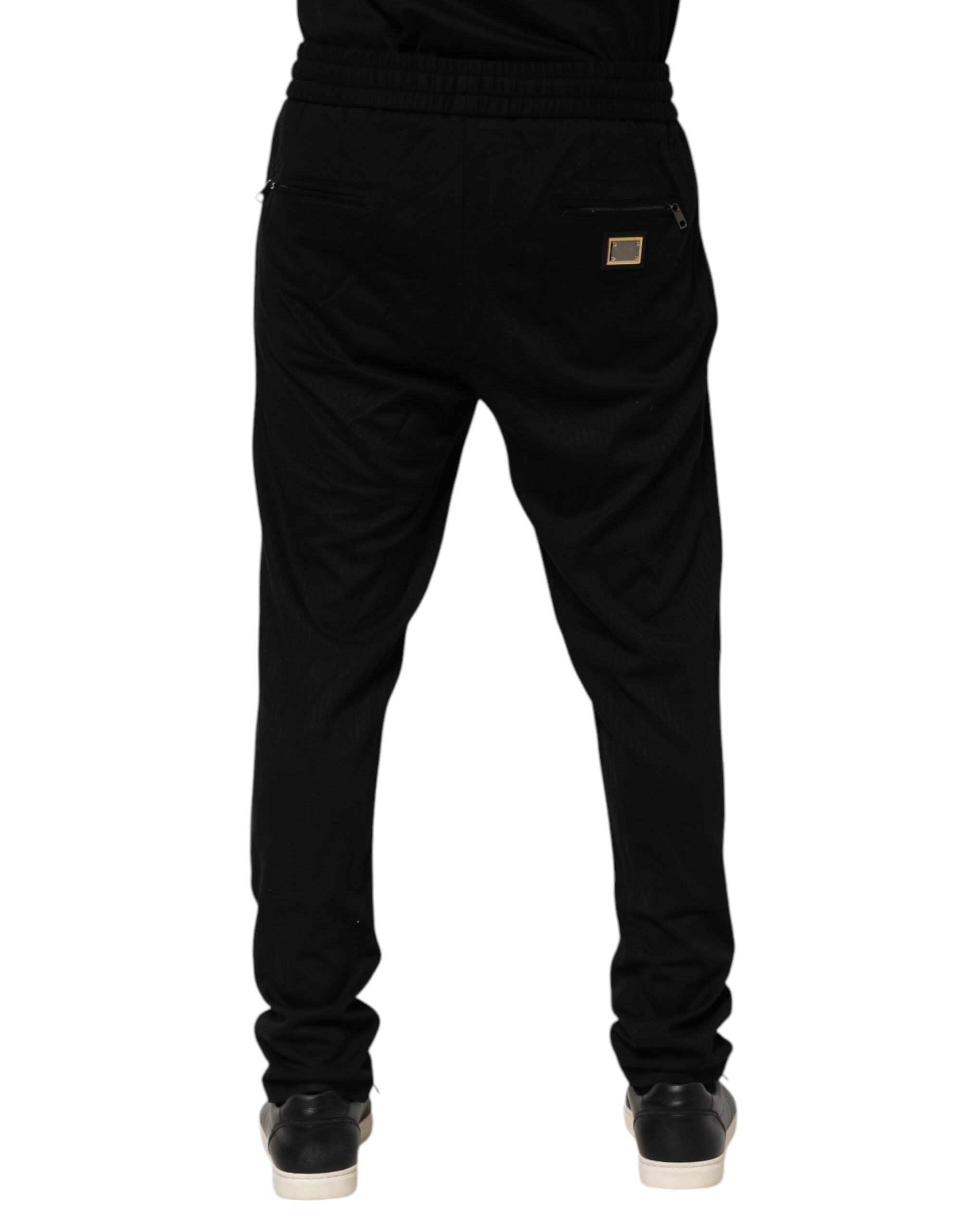 Pantalons de jogging slim noir Dolce & Gabbana en viscose avec logo pour homme, vue de face.