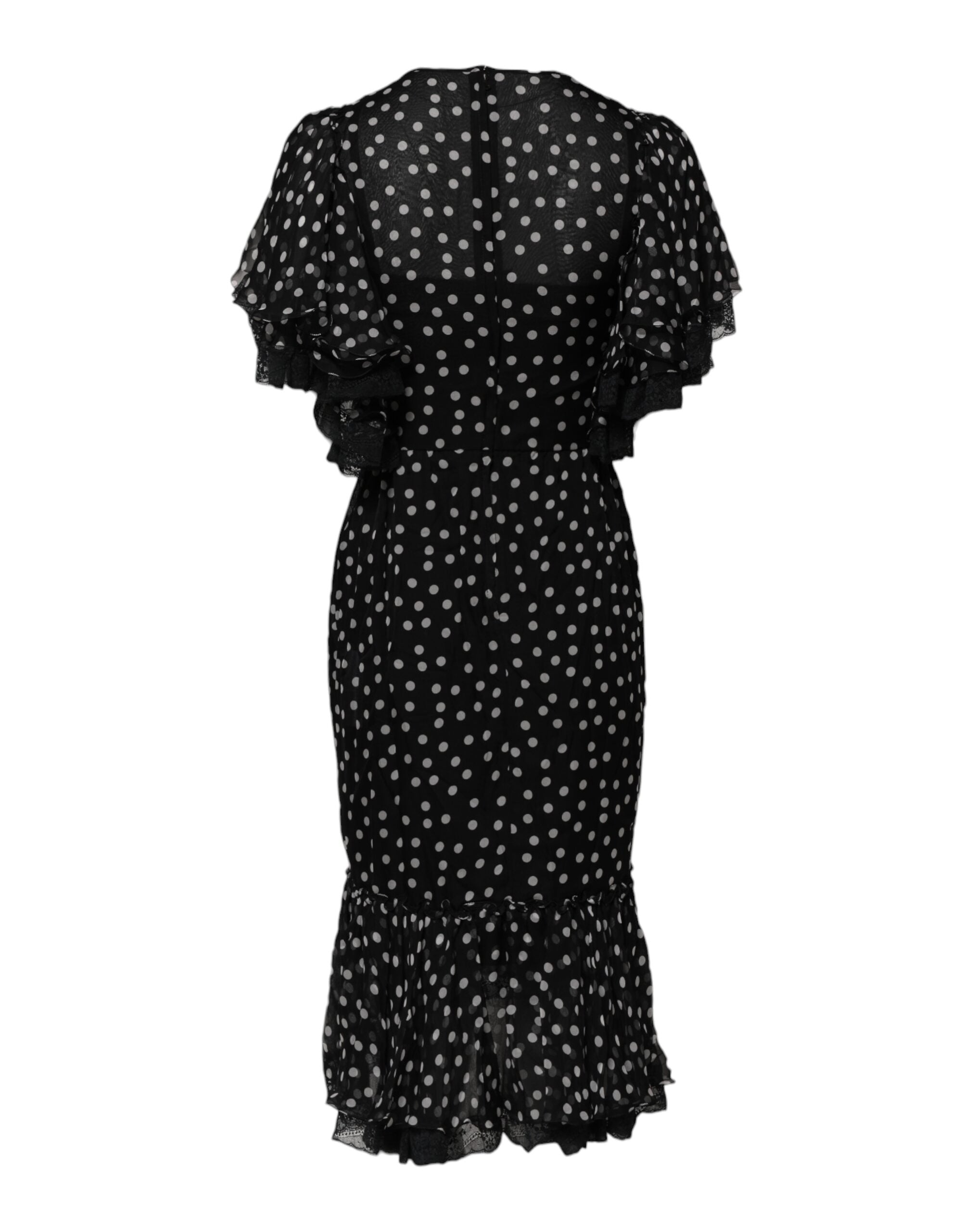 Robe en chiffon noir et blanc à pois en dentelle de Dolce & Gabbana, élégante et sophistiquée, avec détails délicats.