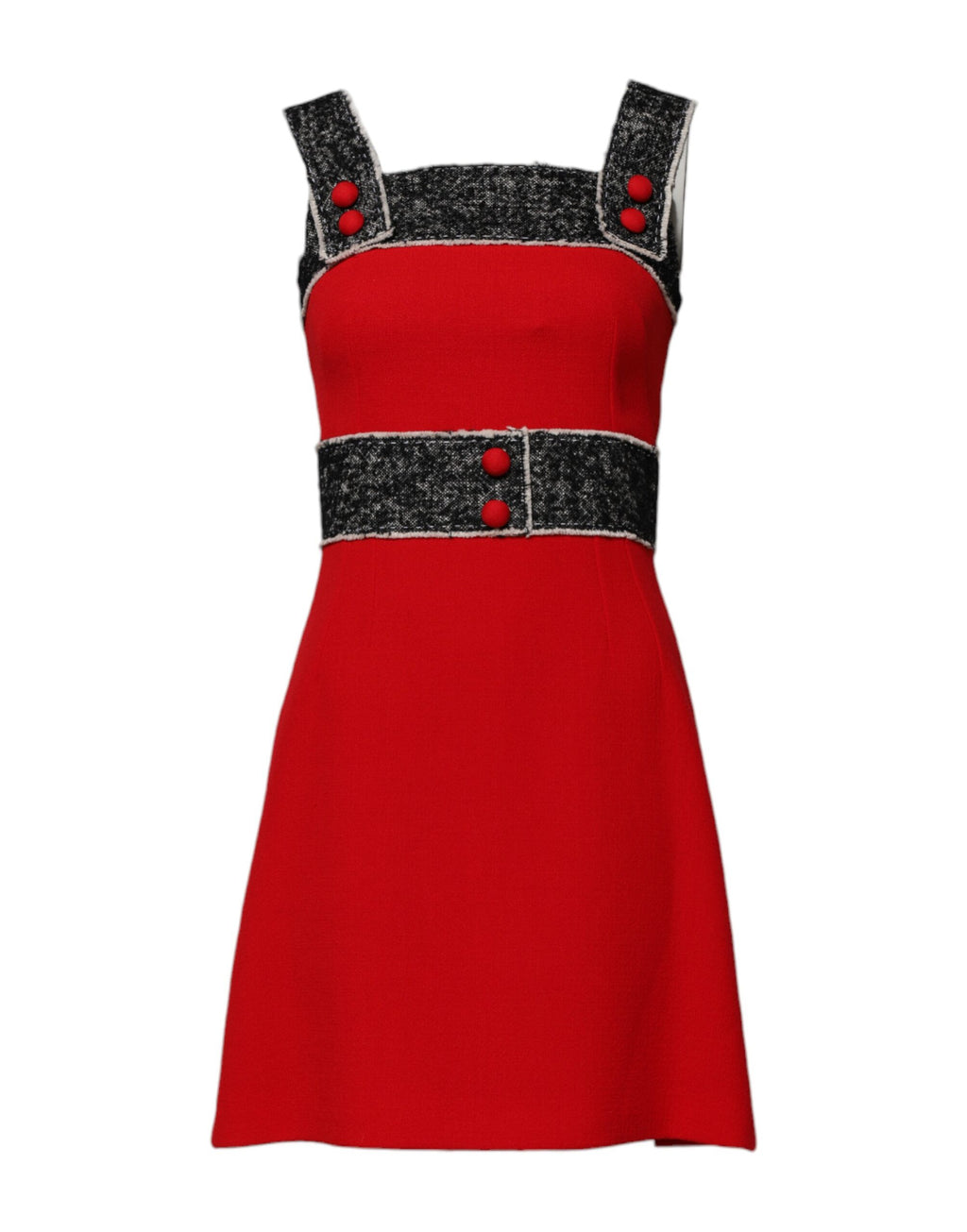 Robe en laine rouge sans manches, coupe évasée et style mini, de la marque Dolce & Gabbana, portée avec un look élégant.