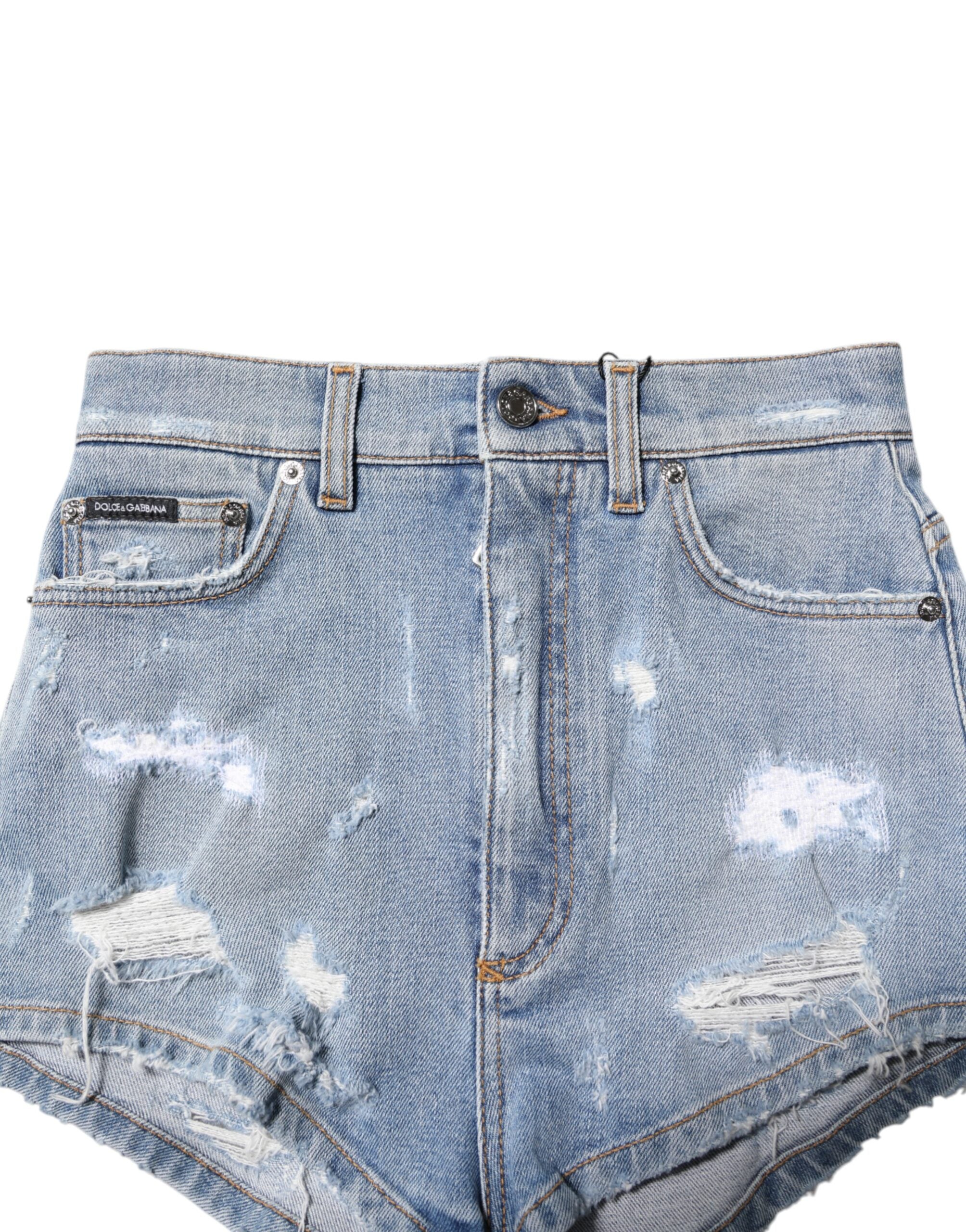 Shorts en jean déchiré en coton bleu Dolce & Gabbana, style hot pants avec détails usés et coupe ajustée.