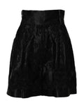 Shorts en soie noire Dolce & Gabbana avec broderie florale et taille haute, élégants et sophistiqués.