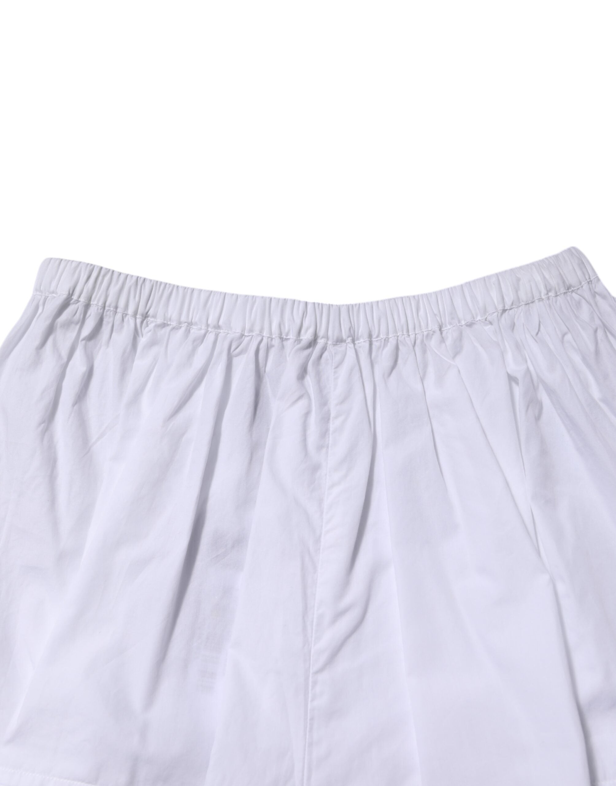 Shorts en coton blanc à taille haute avec panneaux en dentelle, marque Dolce & Gabbana.