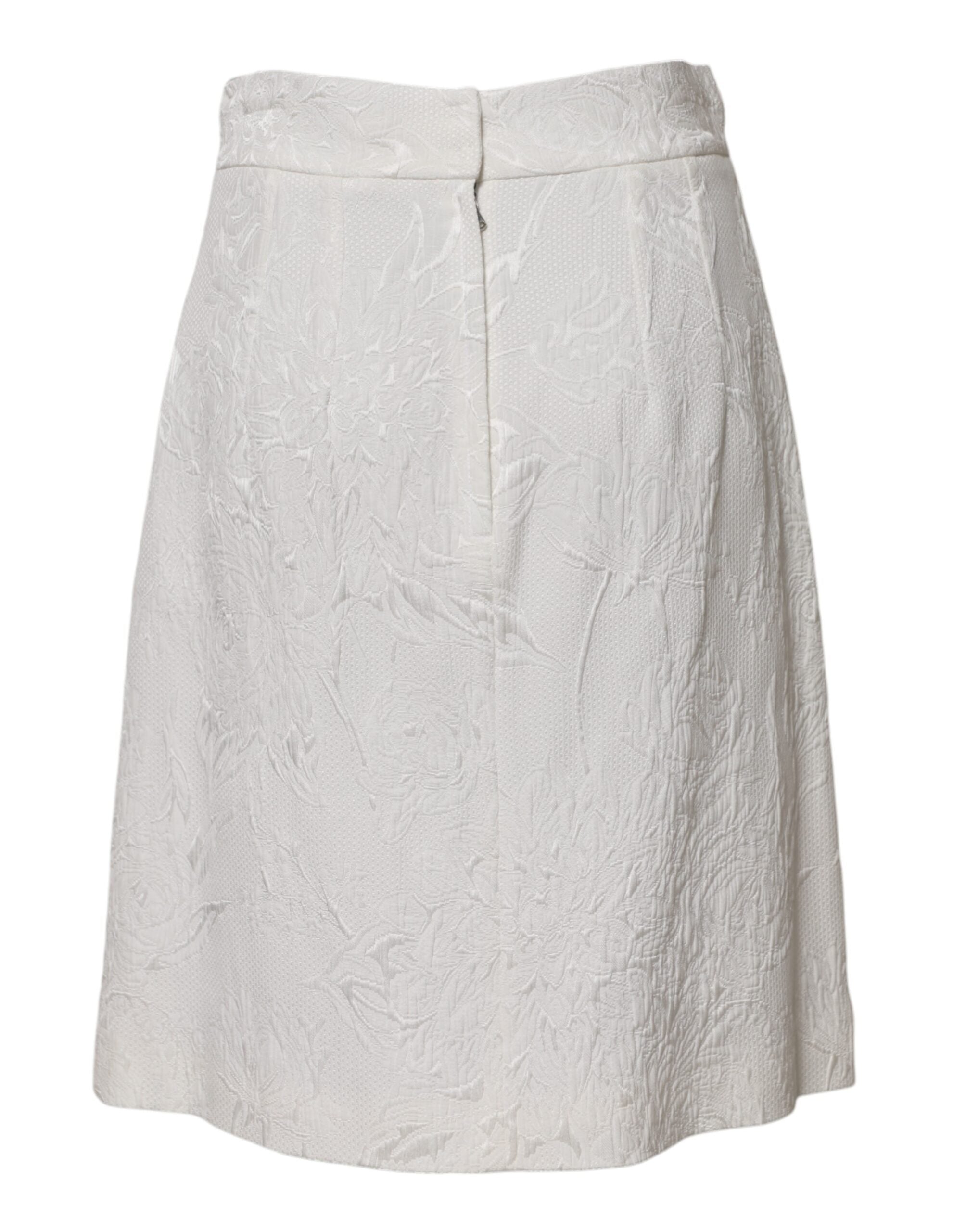 Jupe blanche en brocart florale Dolce & Gabbana, coupe évasée à taille haute élégante et sophistiquée.