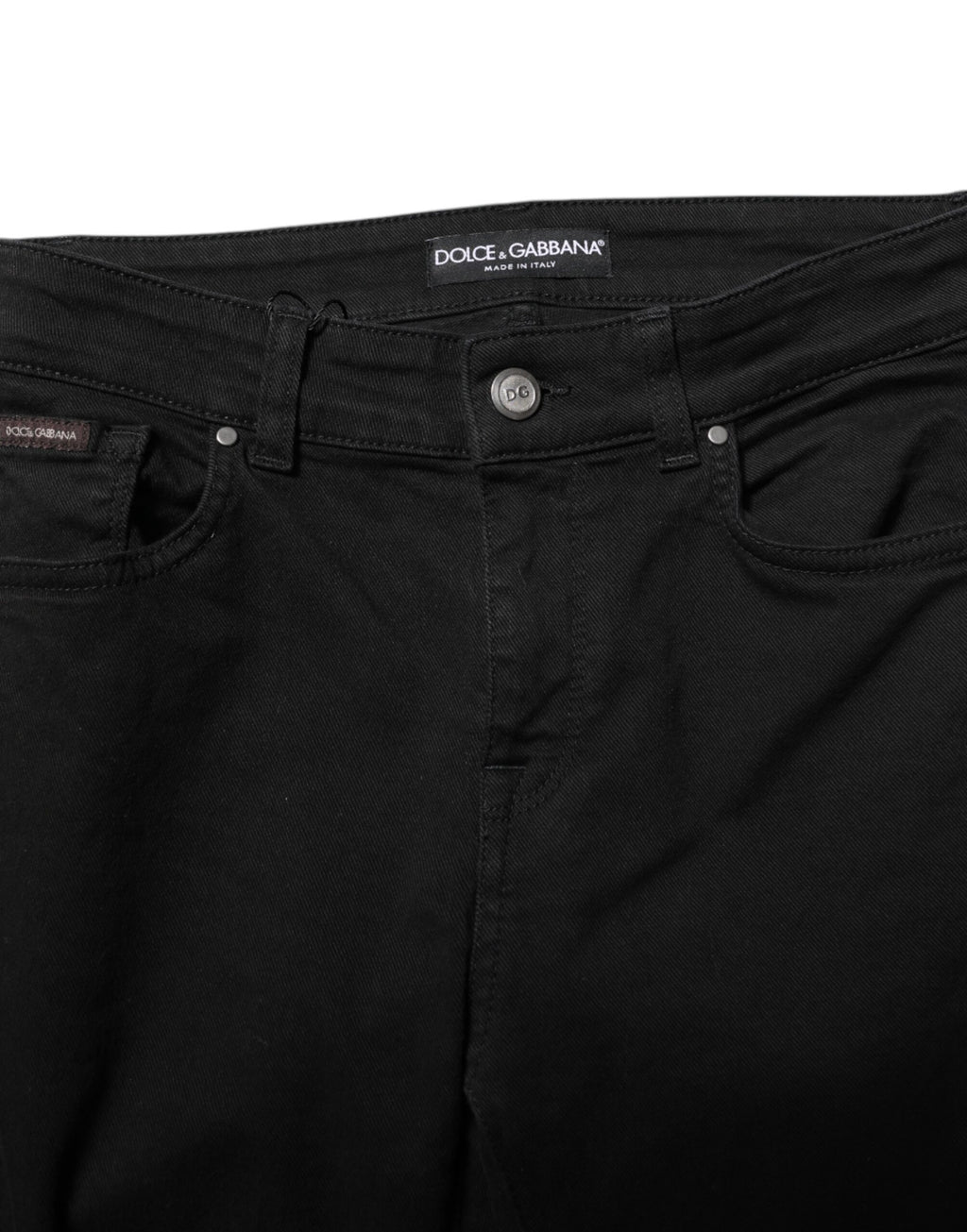 Jeans skinny en coton noir Dolce & Gabbana avec logo, taille mi-haute et coupe ajustée, visible sur l'image.