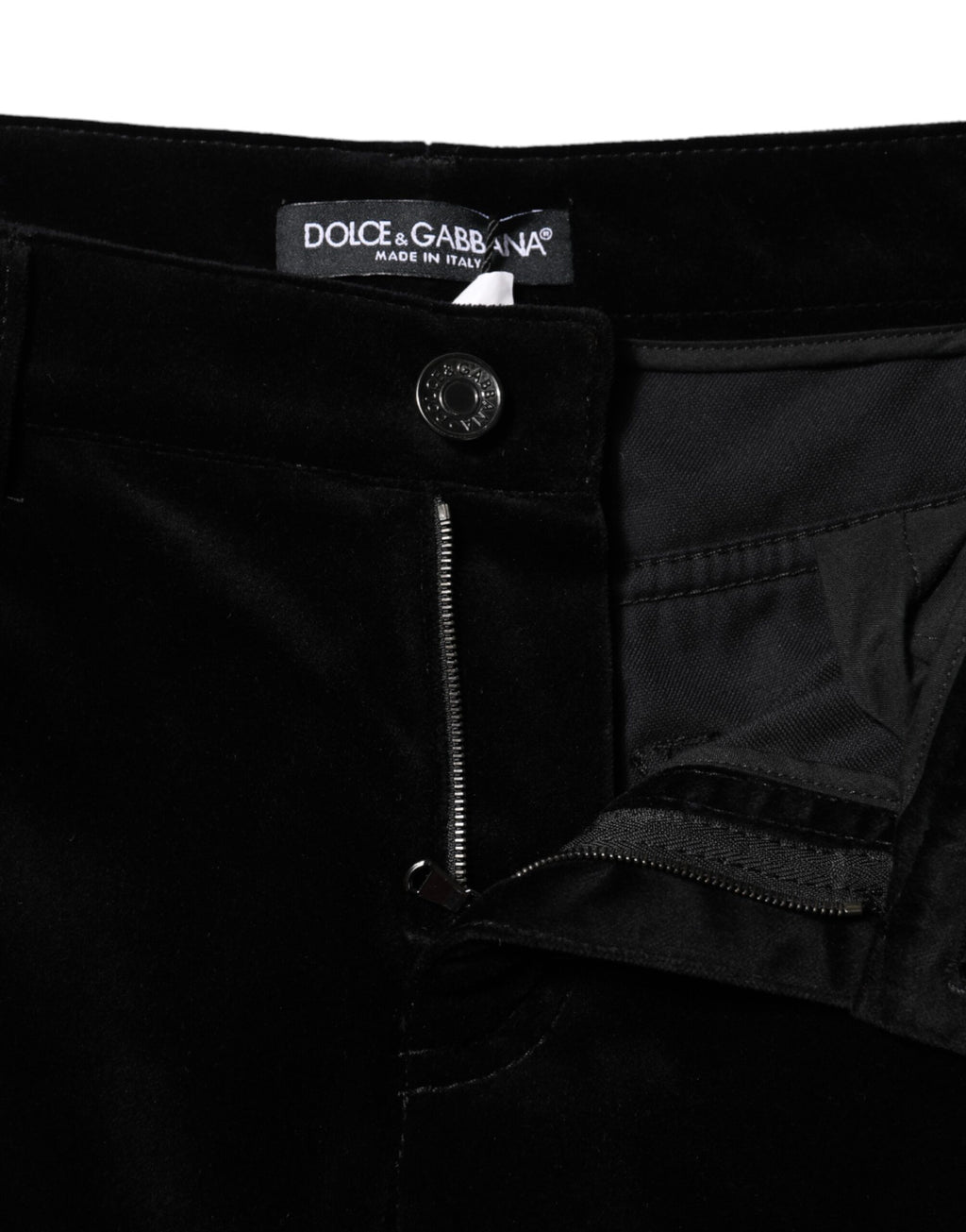 Jeans skinny capri en denim noir Dolce & Gabbana en coton, coupe ajustée et courte, visibles avec détails de couture.