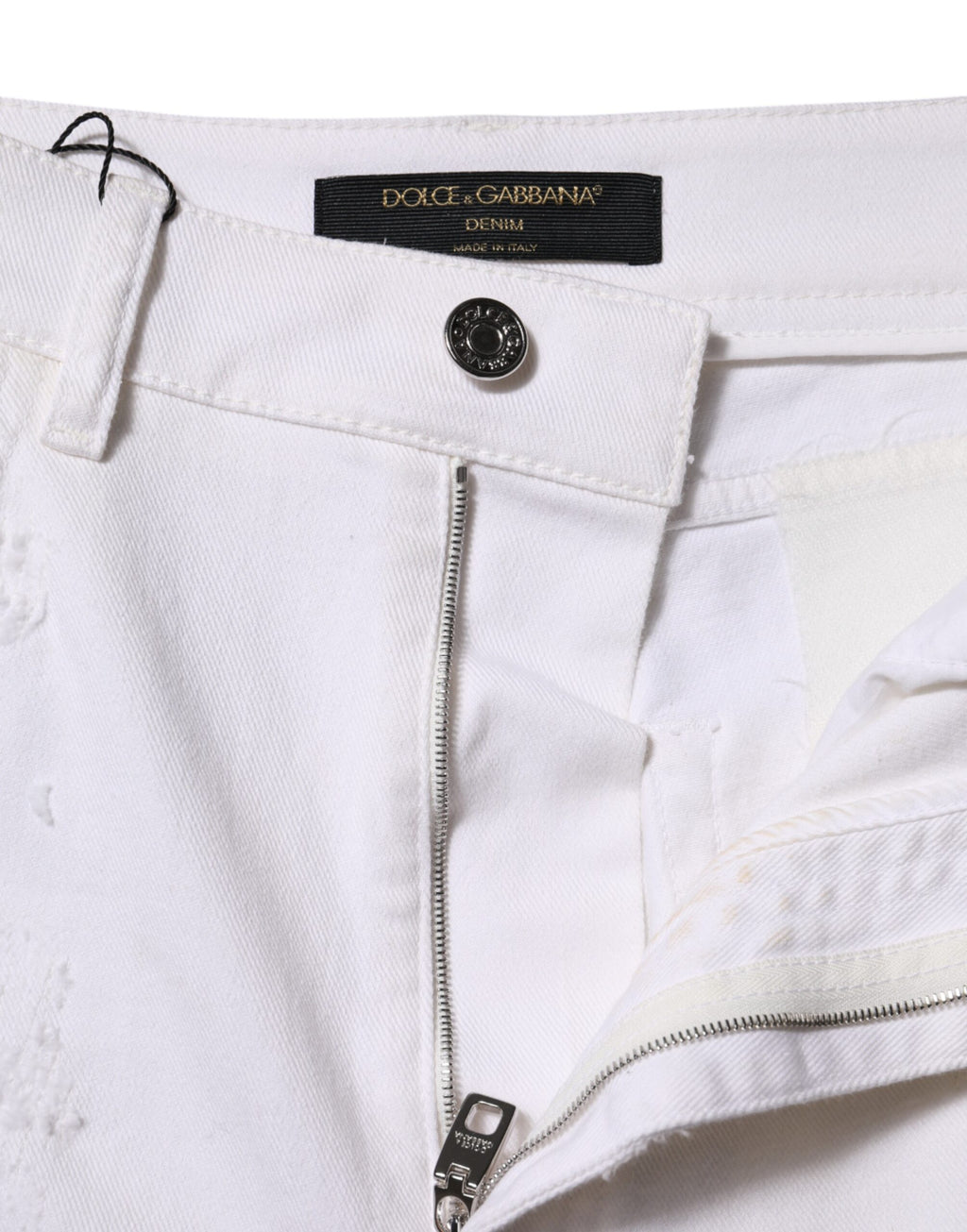 Jeans en denim blanc taille haute de Dolce & Gabbana avec déchirures et style décontracté.