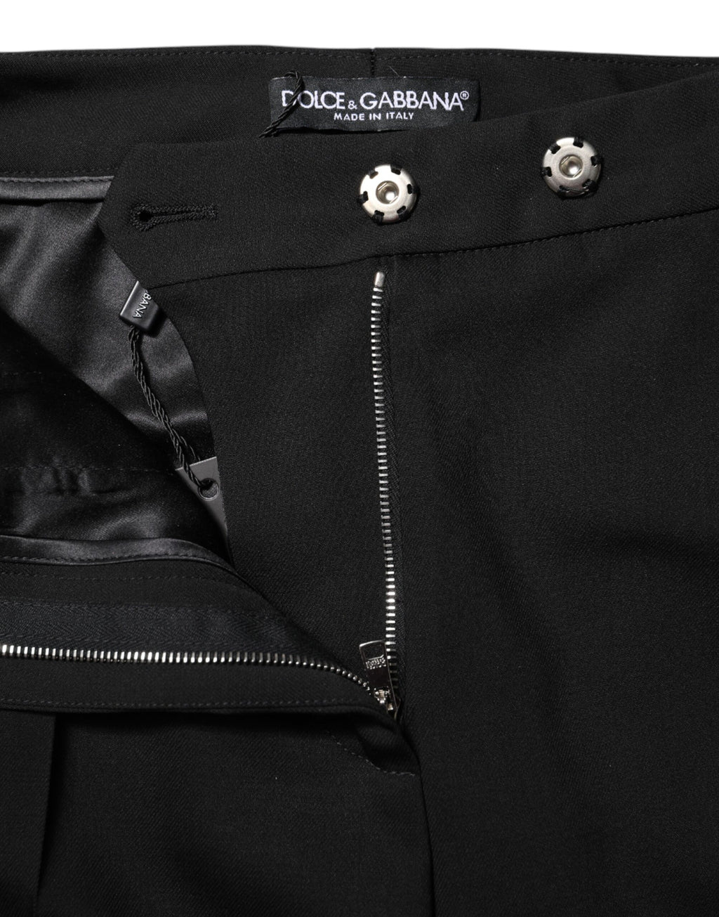Pantalon évasé en laine noire à taille haute de Dolce & Gabbana, coupe élégante et moderne.