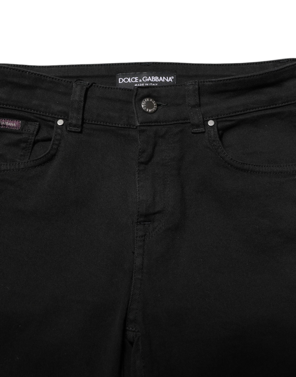 Jeans slim en coton noir de Dolce & Gabbana, coupe skinny et taille mi-haute, visibles avec détails de denim.