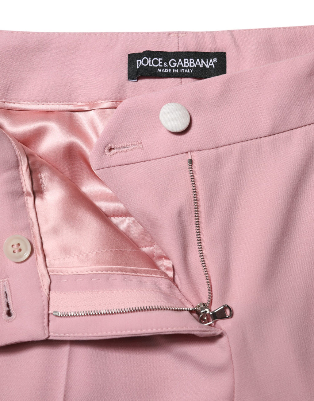Pantalon en laine rose à taille haute et coupe tapered de Dolce & Gabbana, vue de face, détails élégants.