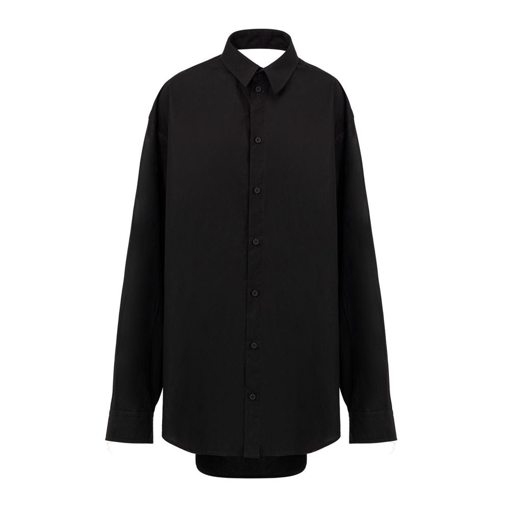 Robe longue noire en coton de Balenciaga, élégante et fluide, portée avec un design moderne et sophistiqué.