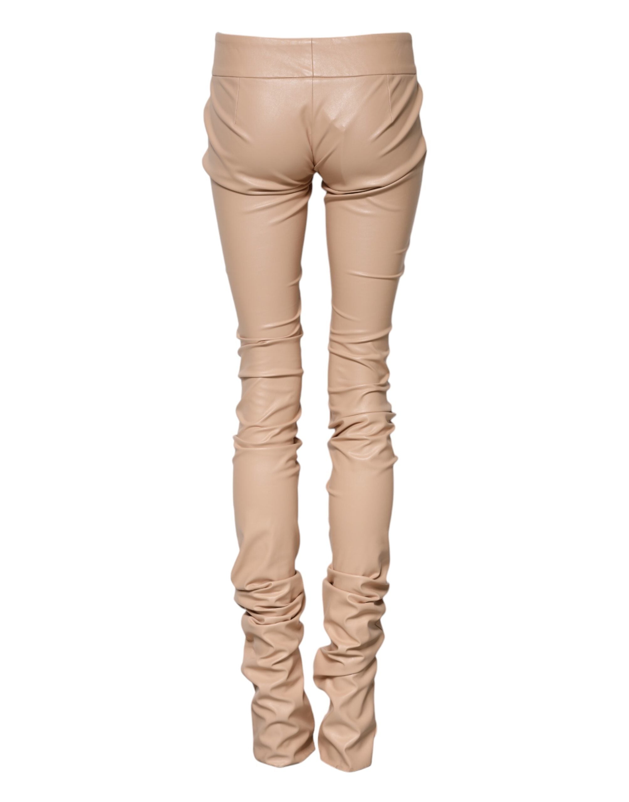 Pantalons skinny beige avec détails en dentelle à la taille moyenne de Dolce & Gabbana, vue de face.