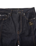Jeans bootcut en coton noir Dolce & Gabbana, taille moyenne, coupe ajustée, visible détails de couture et bouton.