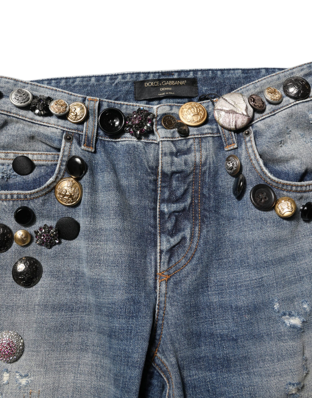 Jeans skinny en denim bleu Dolce & Gabbana avec embellissements et déchirures, style tattered, à la mode et tendance.