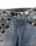 Jeans skinny en denim bleu Dolce & Gabbana avec embellissements et déchirures, style tattered, à la mode et tendance.