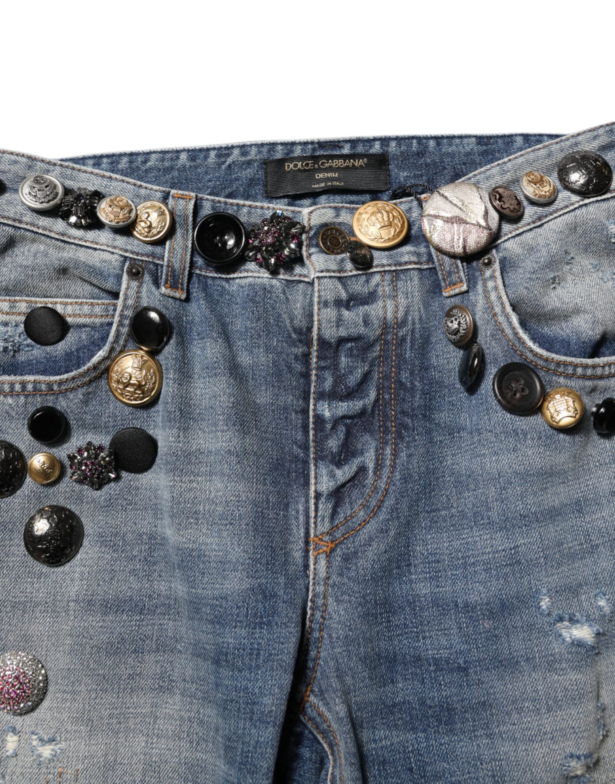 Jeans skinny en denim bleu Dolce & Gabbana avec embellissements et déchirures, style tattered, à la mode et tendance.