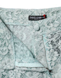 Pantalons en coton vert menthe avec dentelle florale de Dolce & Gabbana, style élégant et floral visible sur l'image.