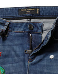 Jeans skinny en coton bleu Dolce & Gabbana à taille moyenne, ajustés et tendance, visibles en détail sur l’image.