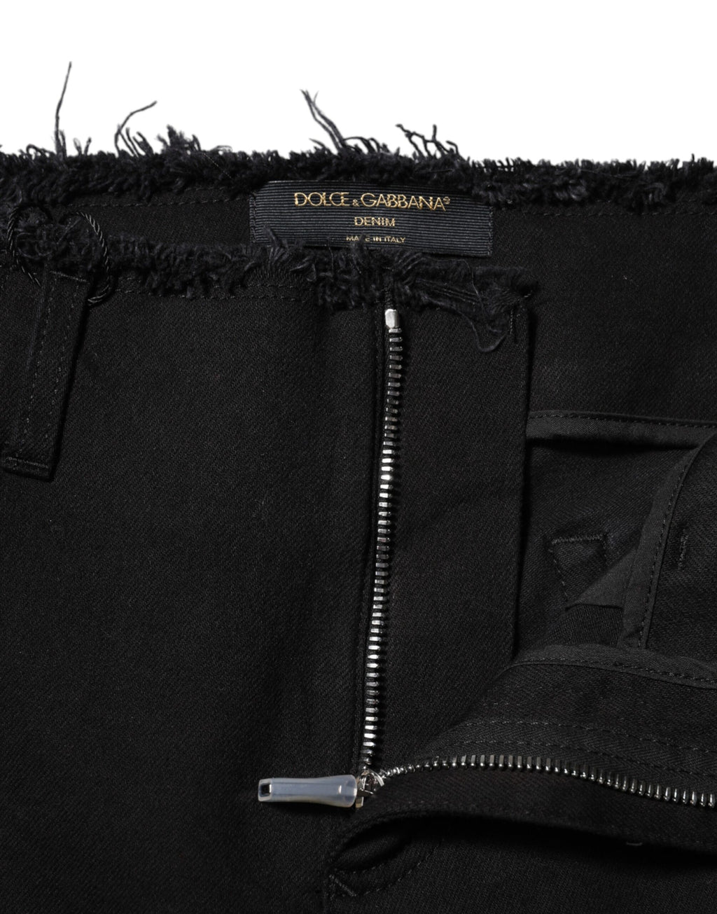 Jeans en denim noir Dolce & Gabbana, coupe évasée à taille moyenne, en coton, visible avec détails de couture.