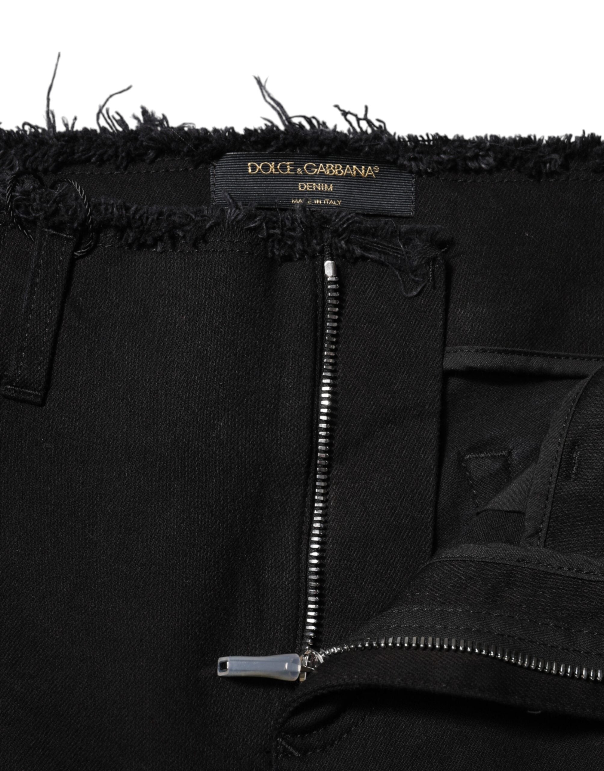 Jeans en denim noir Dolce & Gabbana, coupe évasée à taille moyenne, en coton, visible avec détails de couture.