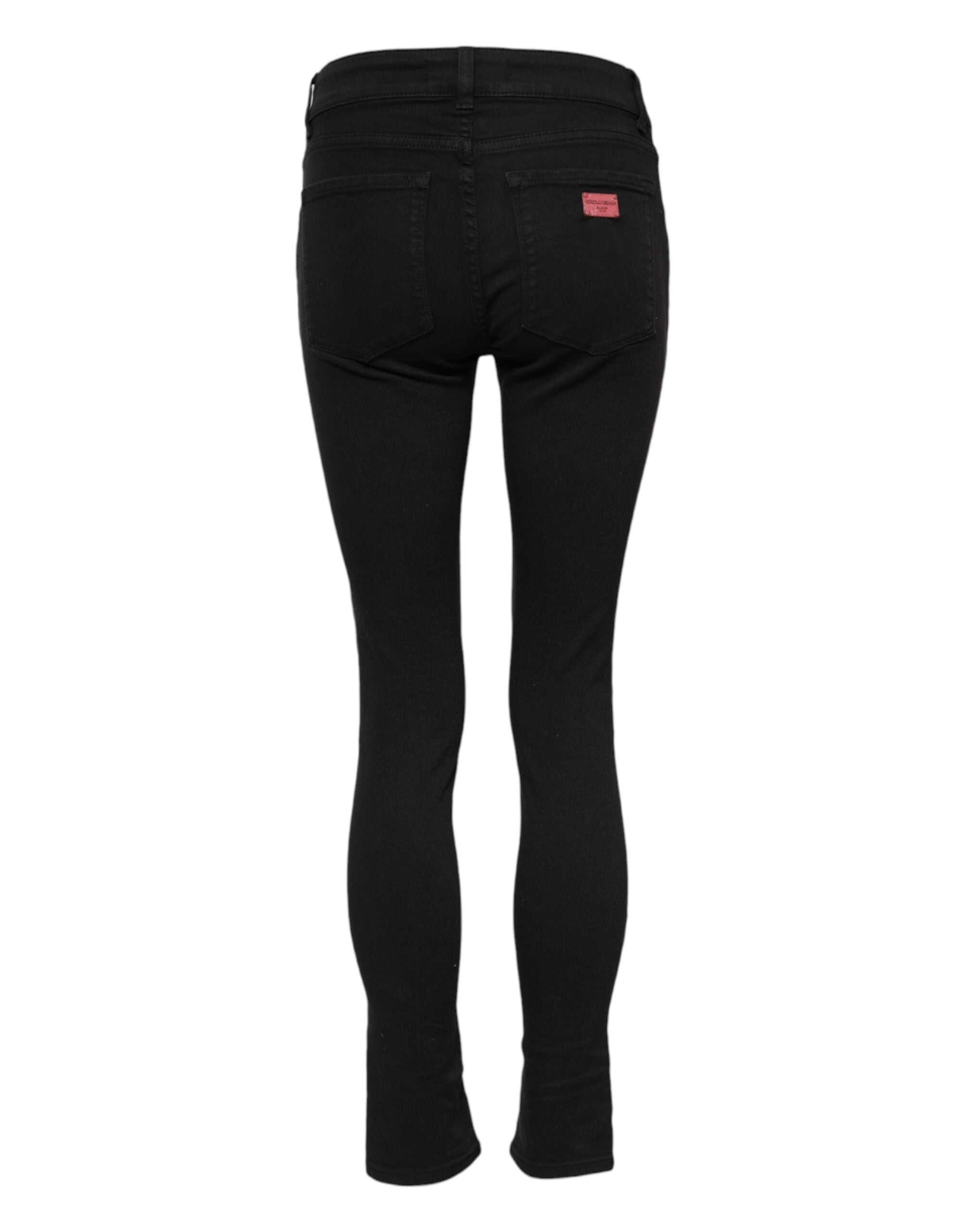 Jeans skinny en coton noir de Dolce & Gabbana avec taille mi-haute, coupe ajustée, détails en denim.