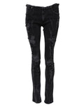 Jeans skinny en denim noir tâcheté en coton Dolce & Gabbana, déchirés et ajustés, visibles avec détails usés et finitions tendance.