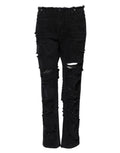 Jeans en denim noir Dolce & Gabbana, coupe déchirée, taille mi-haute, détails usés visibles sur l'image.