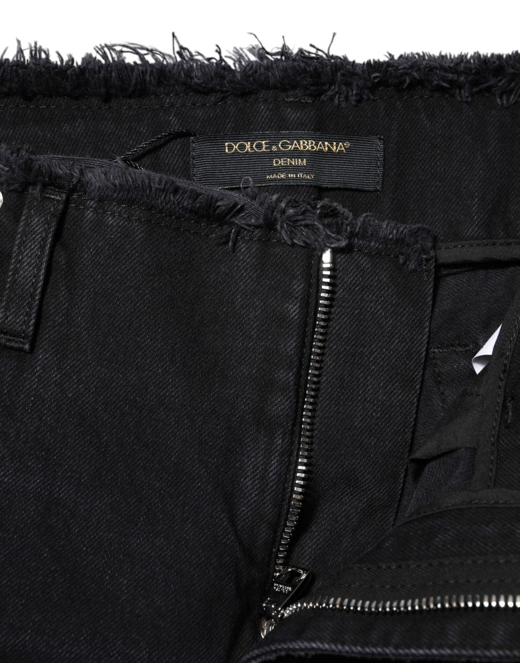 Jeans en coton noir Dolce & Gabbana, déchirés, taille moyenne, denim tendance visible en détail dans l'image.