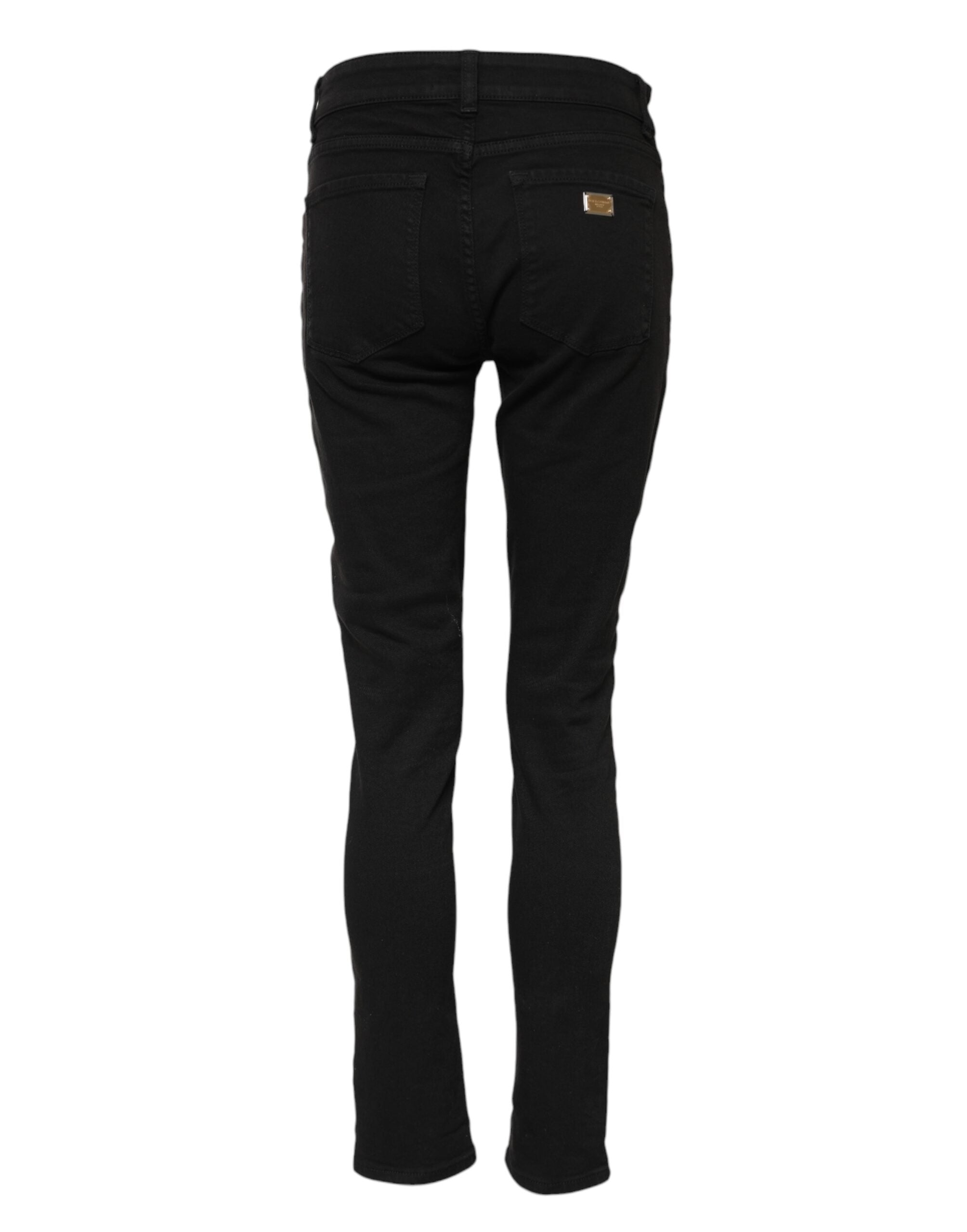 Jeans skinny noirs en coton Dolce & Gabbana avec logo, taille mi-hauteur, ajustés et tendance, visibles en gros plan.