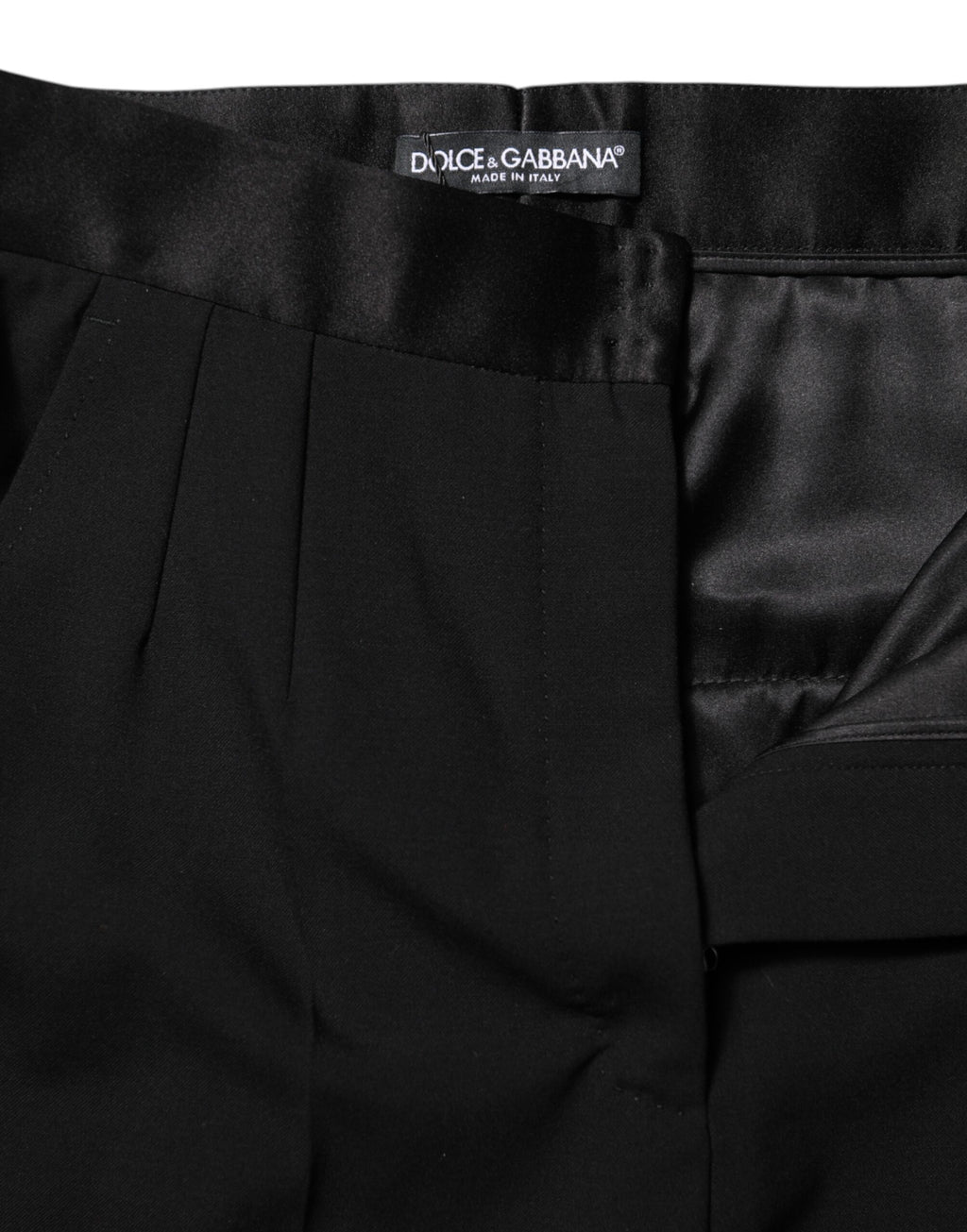 Pantalons noirs en laine Dolce & Gabbana, coupe tapered taille haute, vue de face sur fond blanc.