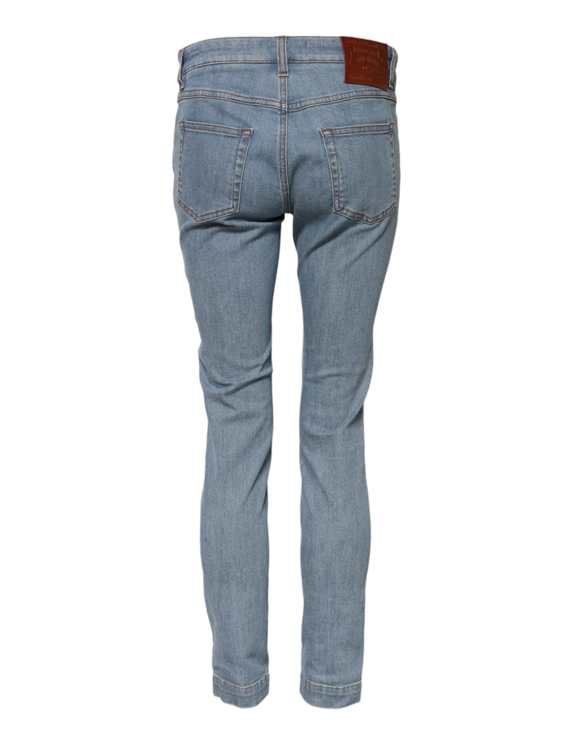 Jeans skinny en coton bleu Dolce & Gabbana, taille moyenne, coupe ajustée, denim élégant, détail de la marque.