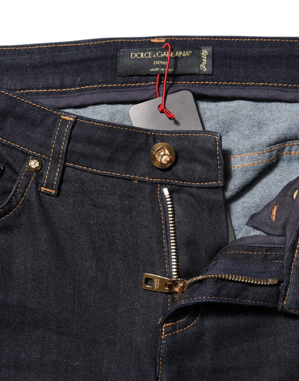 Jeans Skinny en denim bleu Dolce & Gabbana, taille basse, coupe ajustée, coton de haute qualité, mode élégante et tendance.