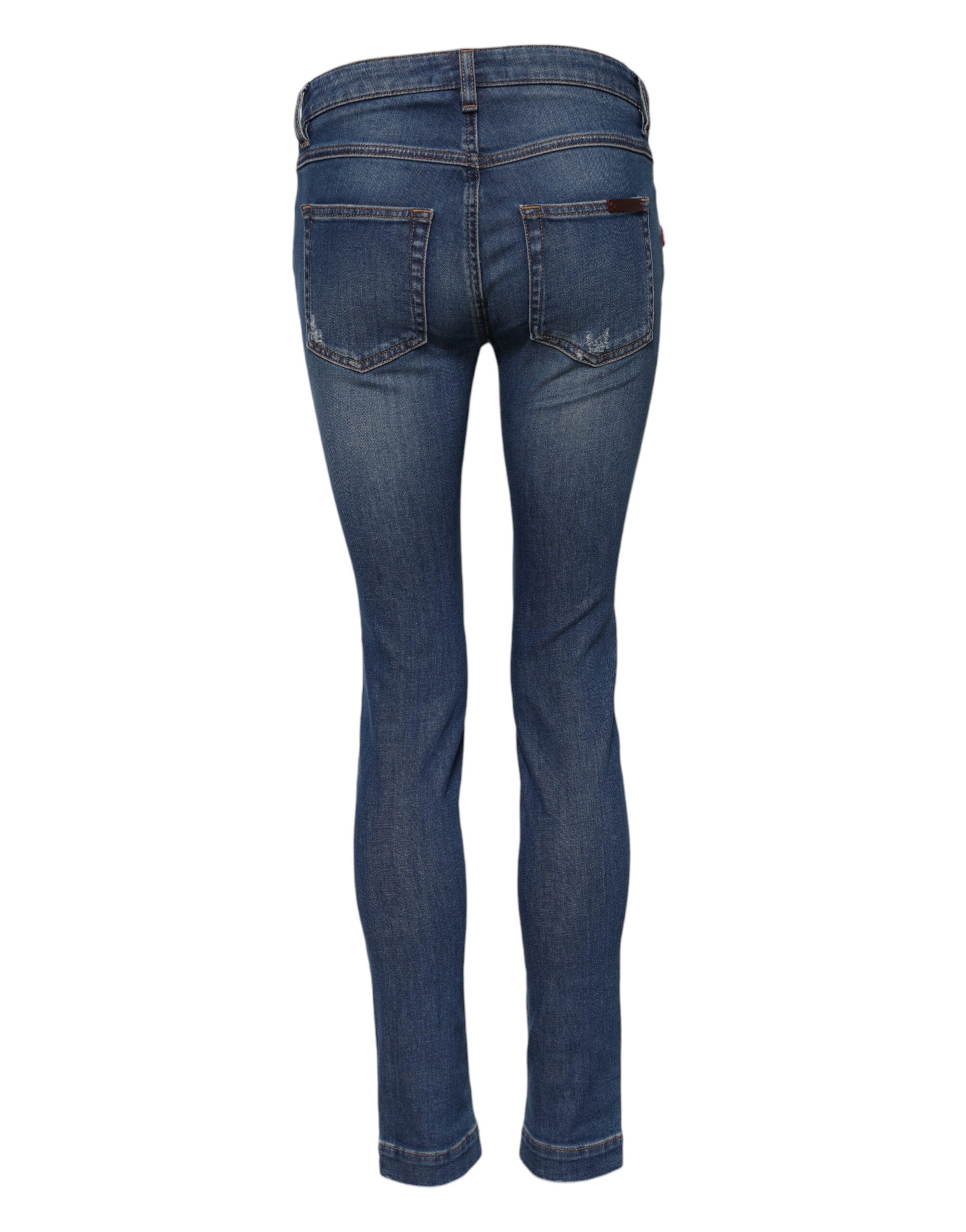 Jeans en denim skinny bleu Dolce & Gabbana en coton à taille basse, vue de face.