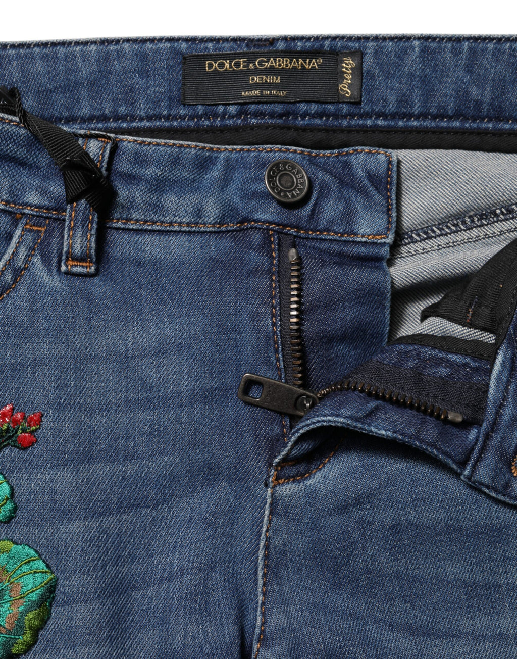Jean skinny en denim coton bleu à taille basse de Dolce & Gabbana, coupe ajustée et moderne, visible sur l'image.