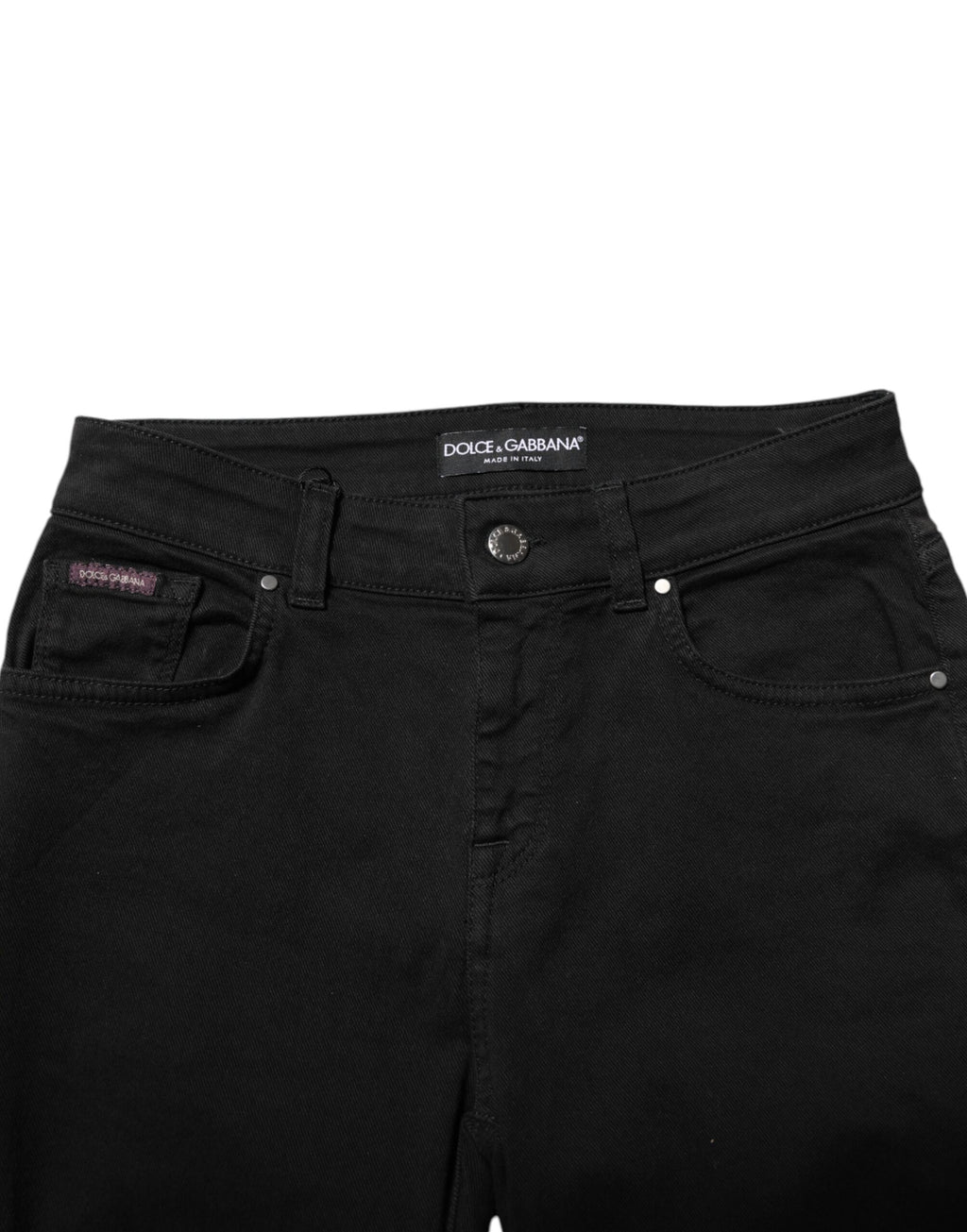 Jeans skinny en denim noir Dolce & Gabbana en coton avec logo, taille mi-haute et coupe ajustée, visibles sur l'image.