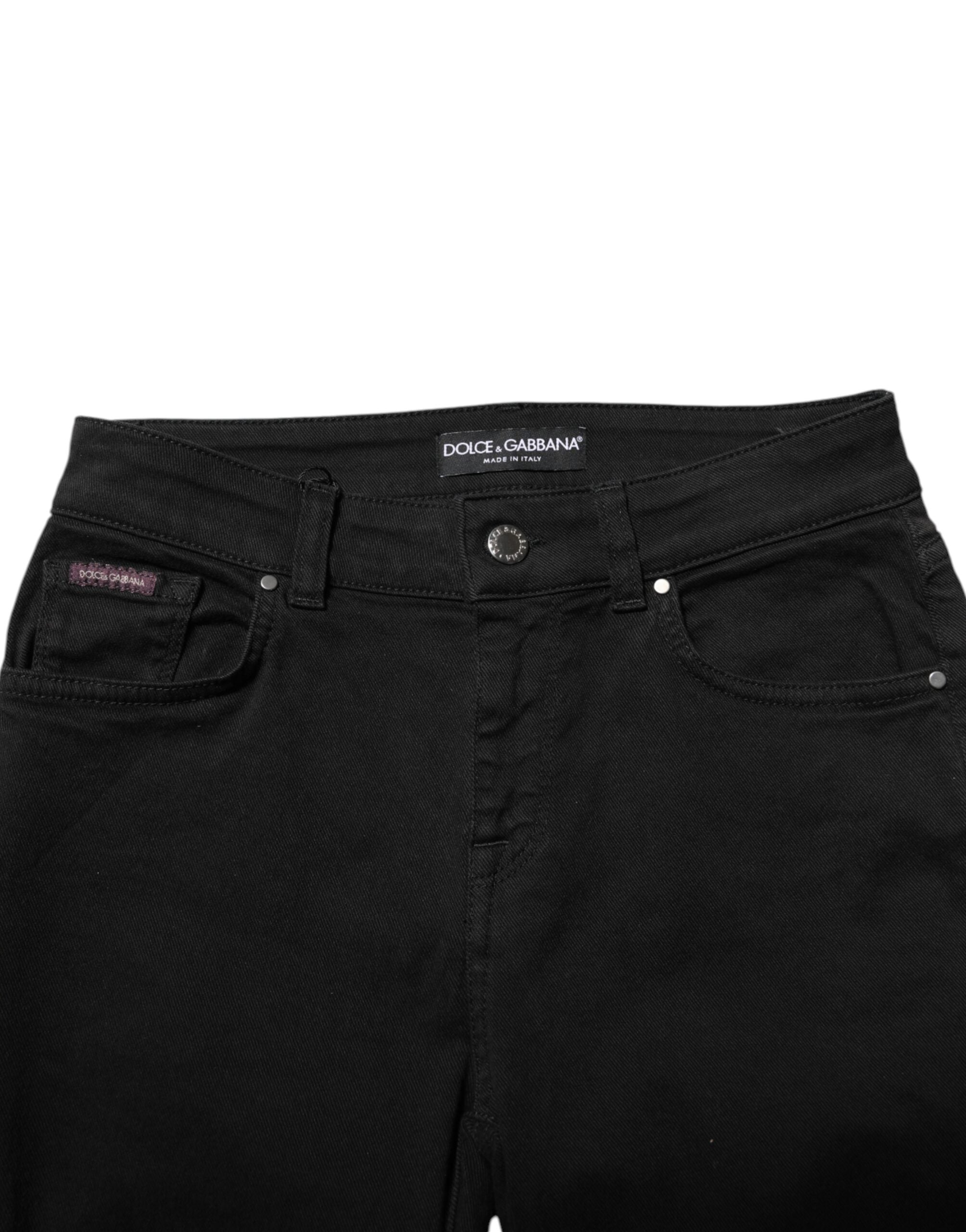Jeans skinny en denim noir Dolce & Gabbana en coton avec logo, taille mi-haute et coupe ajustée, visibles sur l'image.